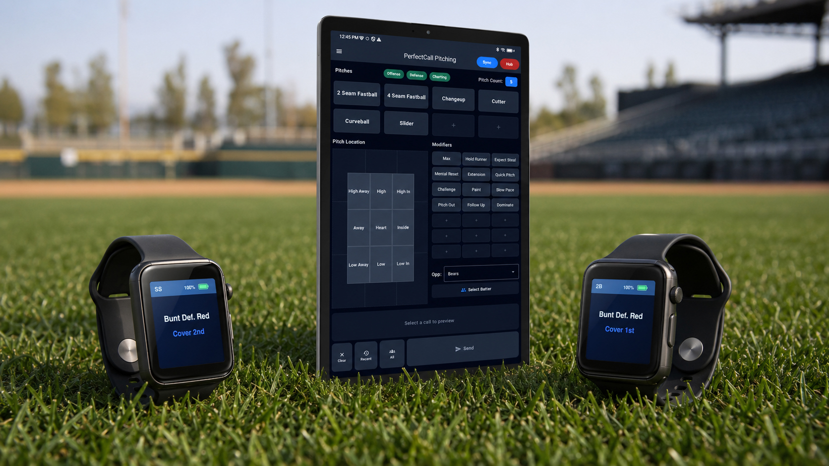 Coach tablet and two P1 wrist devices on the grass
